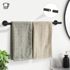 TURS towel ring in matte black complements the towel bar for a cohesive look.