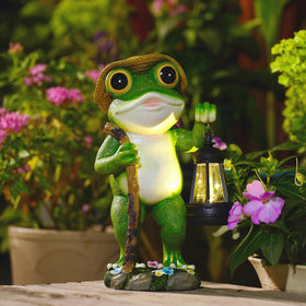 Twinbling illuminated frog figure serves as a whimsical garden focal point.