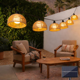 TWINKVILLA Solar Rattan Light branch drape creates warm outdoor ambience.
