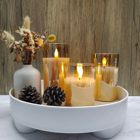 Tyawon flameless candle glows in living room for safe night light.