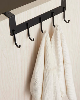 UDENIS bathroom towel rack in use beside bathroom door