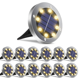 OULONGER solar ground light with warm glow illuminating a garden pathway