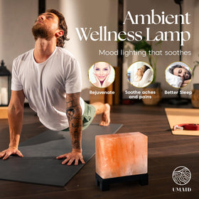 UMAID rectangle salt lamp on desk gives soothing, mood-enhancing glow.