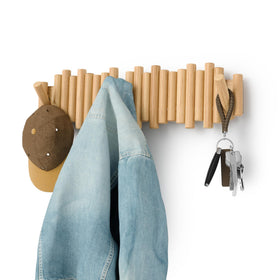 Umbra Picket coat rack wall mount with eight hooks for organized entryways.