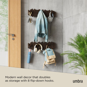 Umbra Picket entryway coat rack offers versatile storage for hats, scarves, and bags.