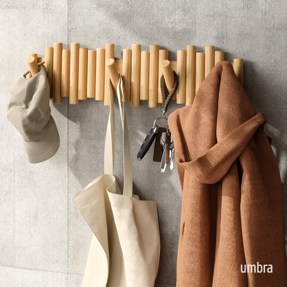 Flip-down hooks on Umbra Picket provide easy access and concealed storage.