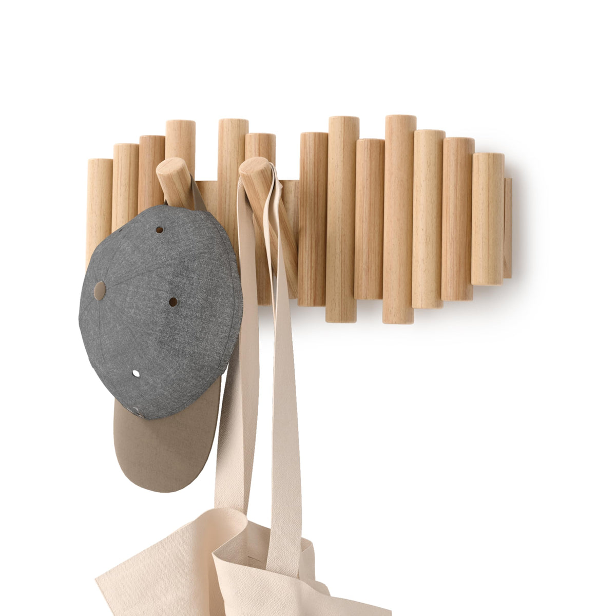 Umbra Picket wall mount coat rack with five flip-down hooks keeps coats organized.