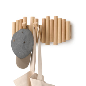 Umbra Picket wall mount coat rack with five flip-down hooks keeps coats organized.