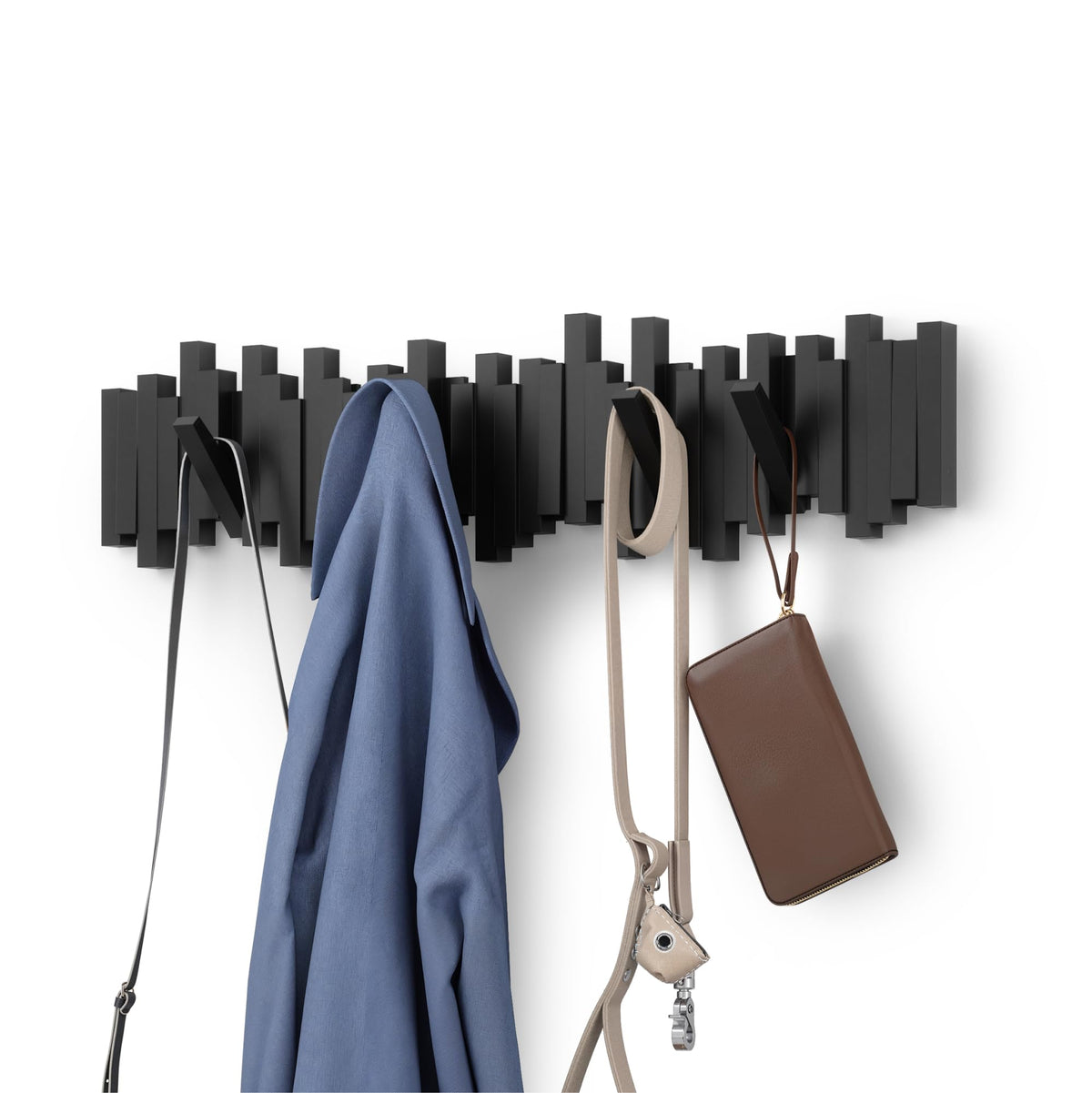 Umbra Sticks with eight retractable pegs for compact wall storage