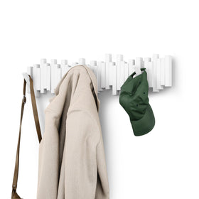 Umbra Sticks wall-mounted coat rack with eight flip-down hooks for organized entryways.