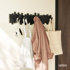 Umbra Sticks wall-mounted coat rack in black saves space in small foyers