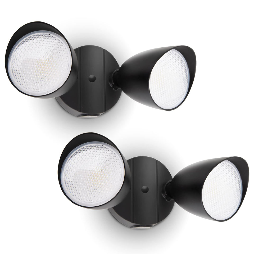 UME 2-pack dual-head floodlight illuminating outdoor entryways and walkways.