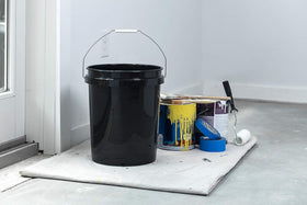 United Solutions ergonomic metal handle bucket with comfortable grip for carrying heavy loads.
