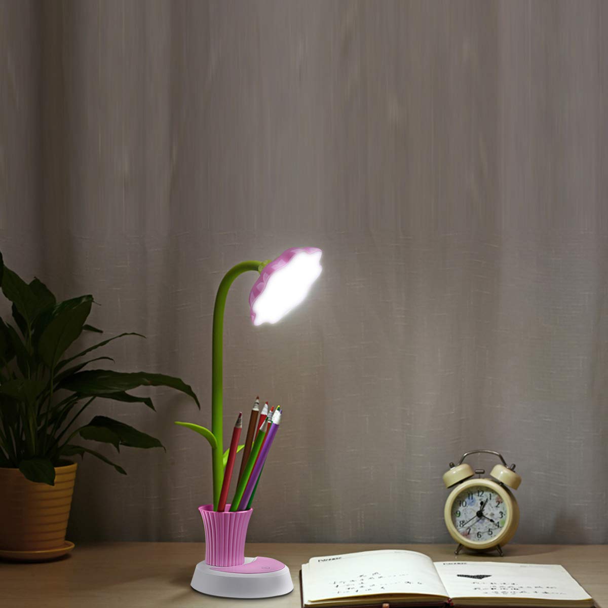 Uniwit pink desk lamp adds playful style to a study nook.
