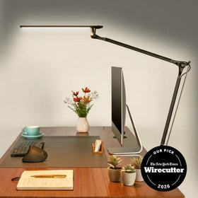 Swivel joints on the UPLIFT DESK E7 provide flexible angles for precise task lighting.