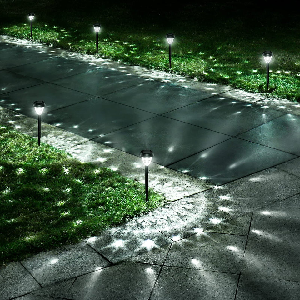 URAGO mandala-pattern solar light brightening walkway at dusk