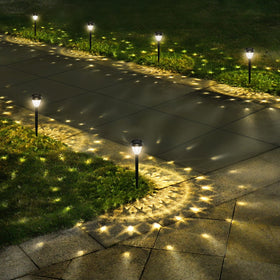 URAGO Super Bright Solar Lights along walkway projecting a vibrant mandala pattern