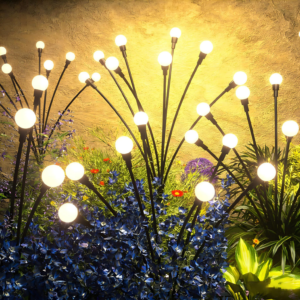 Urllyia solar firefly lights illuminate outdoor spaces with a warm layered glow.