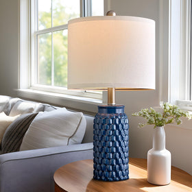 USumkky pair of lamps on nightstands creates balanced symmetry.