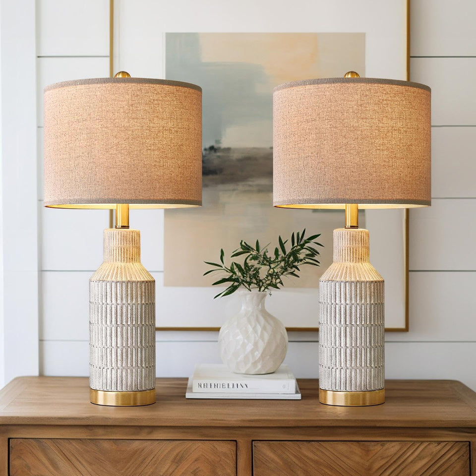 USumkky white-washed ceramic lamp base adds a sleek bedside statement with versatile living room appeal.