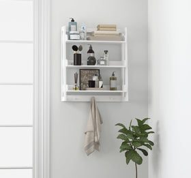 UTEX wall shelf with hooks organizes towels and robes.