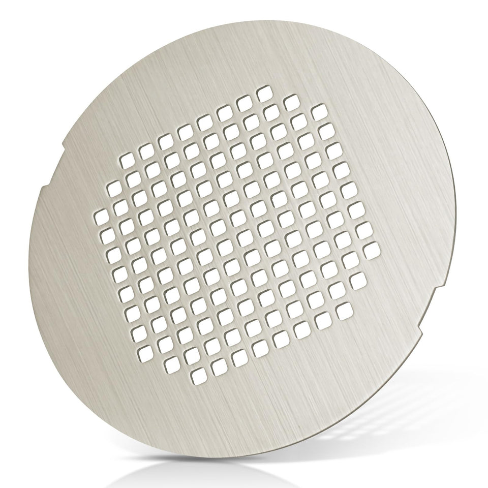 Uxoz shower drain cover with brushed silver front keeps hair out while maintaining a sleek look
