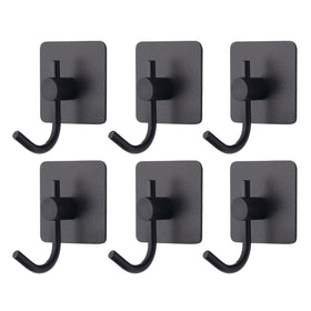 VAEHOLD adhesive wall hooks black installed for clutter-free entryway.