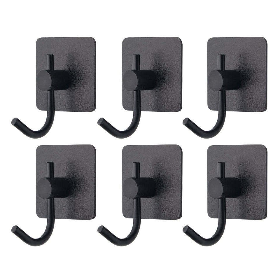VAEHOLD adhesive wall hooks black installed for clutter-free entryway.