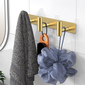 VAEHOLD gold T-shape wall mount on entryway wall for keys and bags