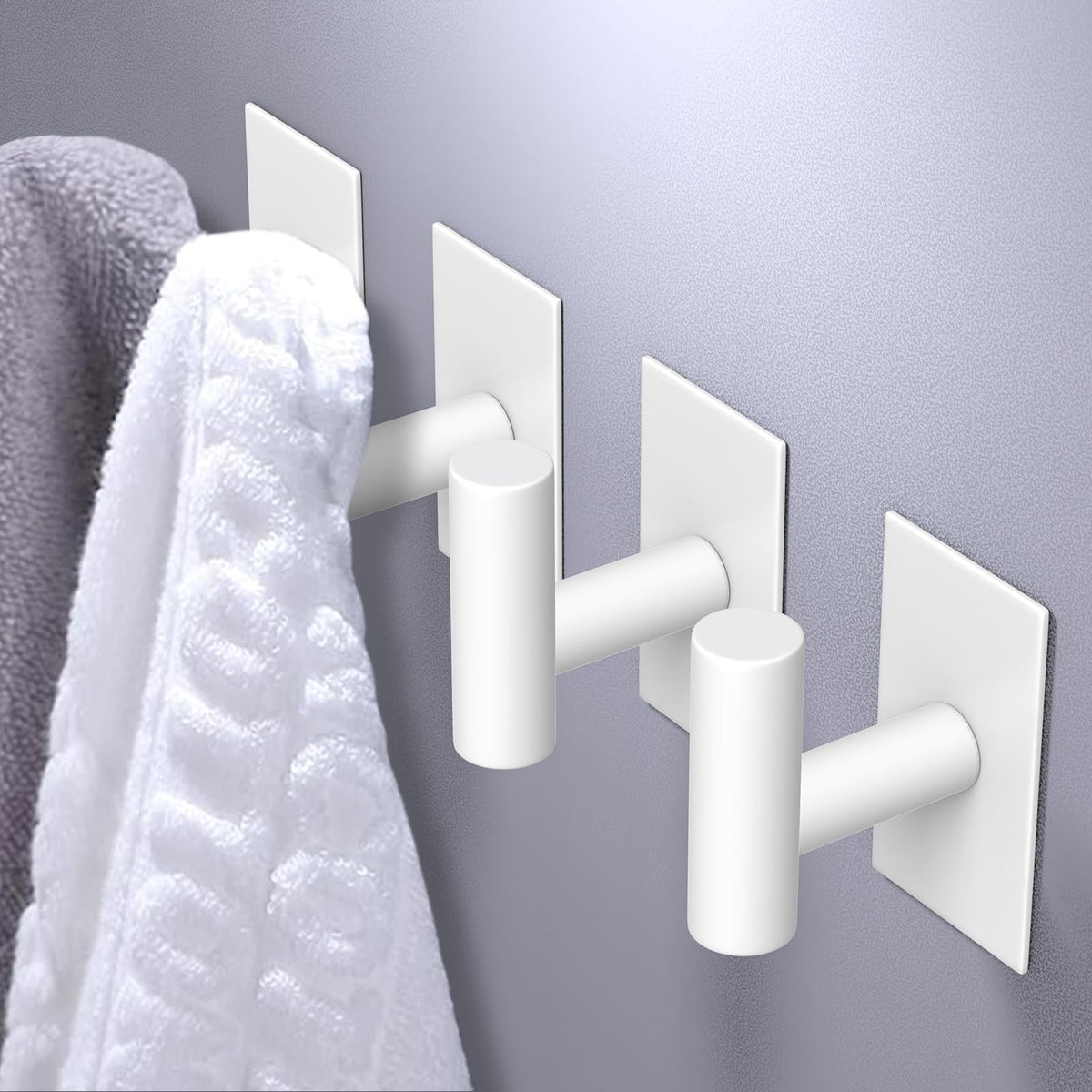VAEHOLD heavy-duty towel hook on wall demonstrates strong adhesion.