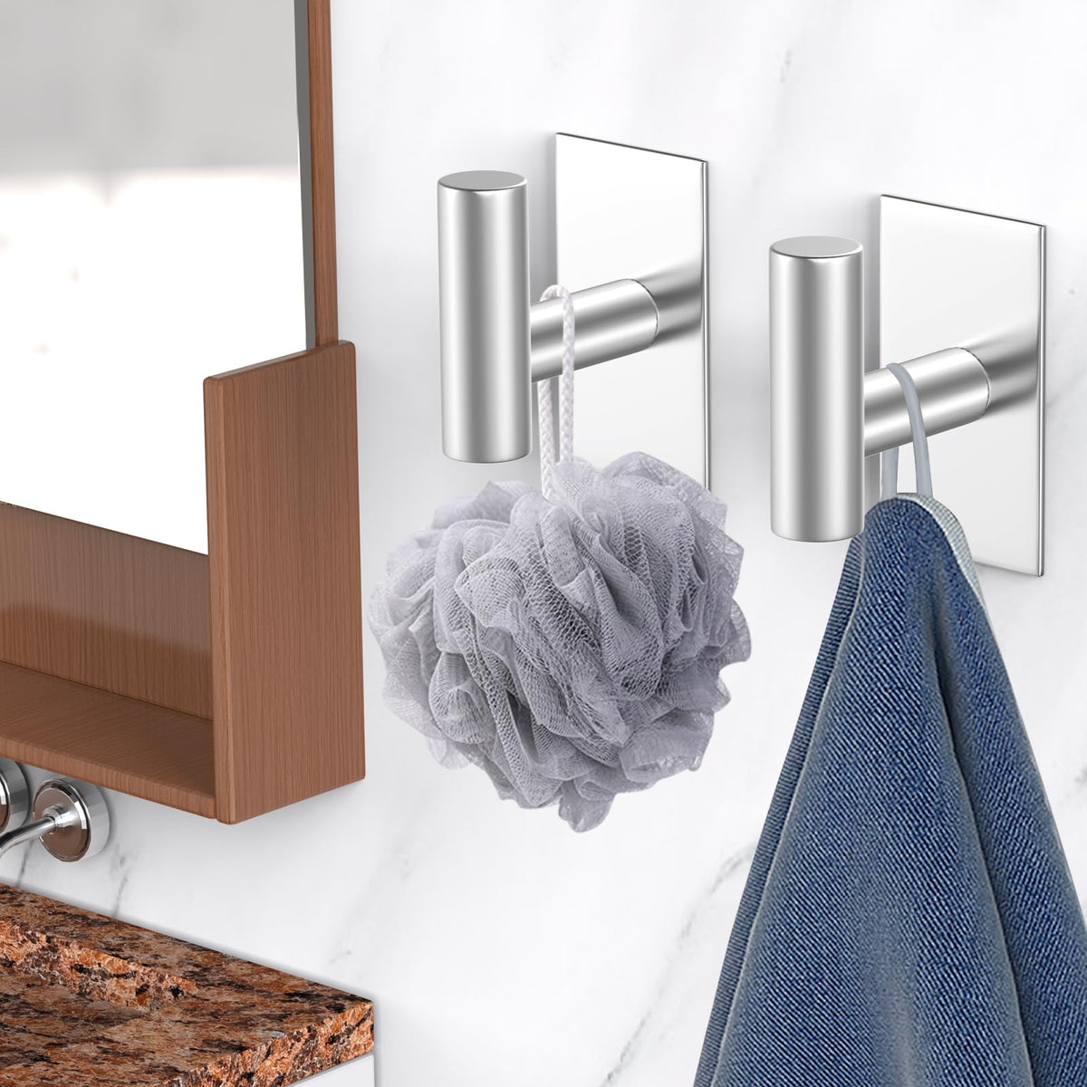 VAEHOLD heavy-duty wall hook in use with garments on wall.