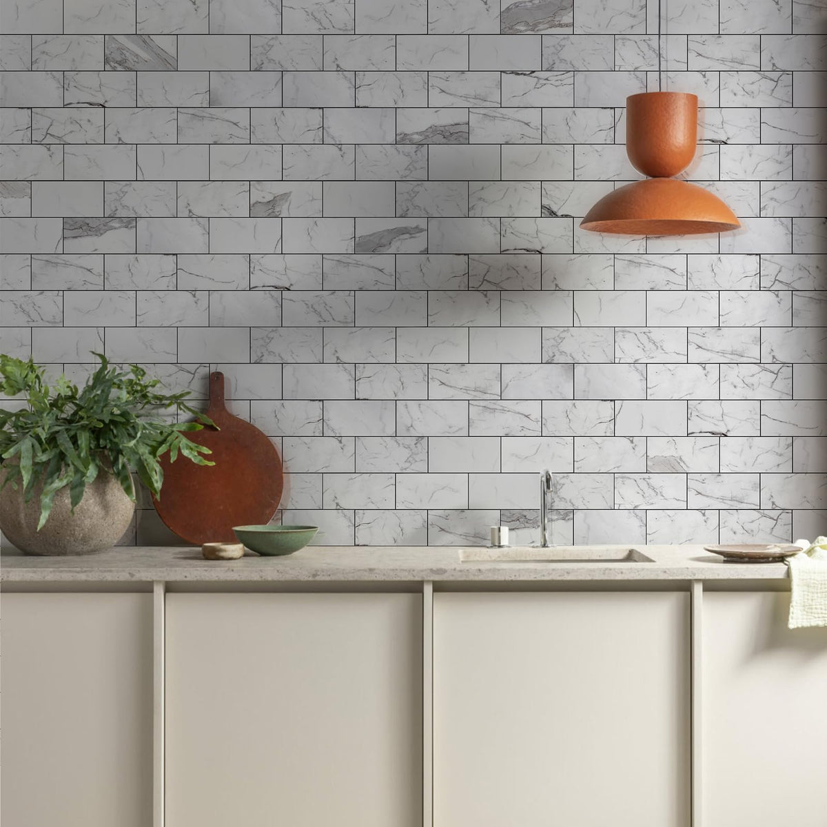 Vamos Tile dark gray grout strip shows modern contrast for bathroom and kitchen surfaces.