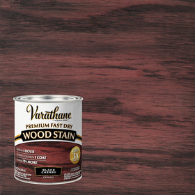 Varathane brush applying stain demonstrates smooth, even coverage on wood.