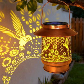 Vcdsoy hummingbird lantern for outdoor use with warm garden illumination.