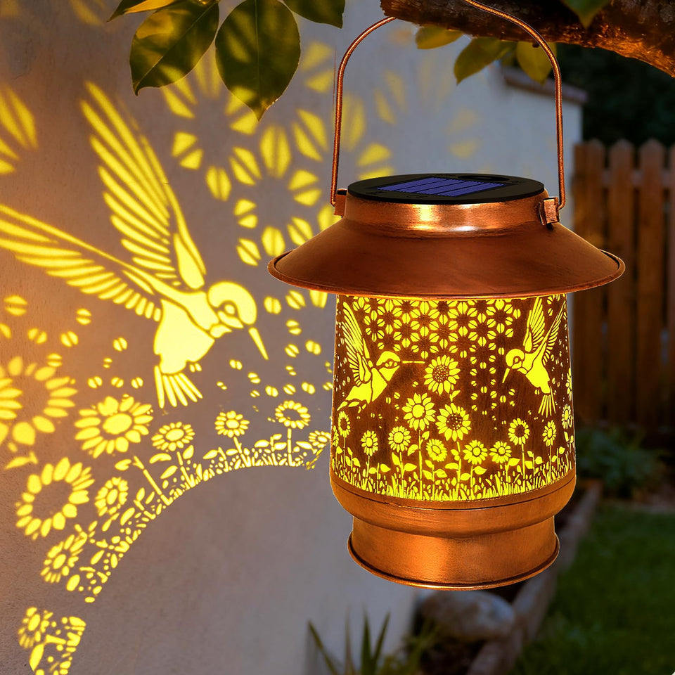 Vcdsoy hummingbird lantern for outdoor use with warm garden illumination.