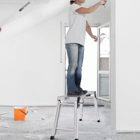 VEVOR adjustable work platform enables reaching high areas without ladders.
