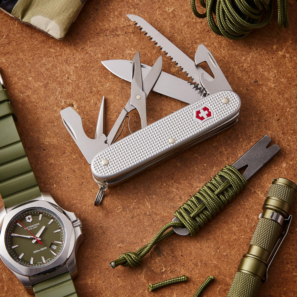 Victorinox Farmer X Alox compact pocket knife in a silver finish.