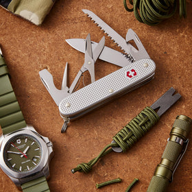 Victorinox Farmer X Alox compact pocket knife in a silver finish.