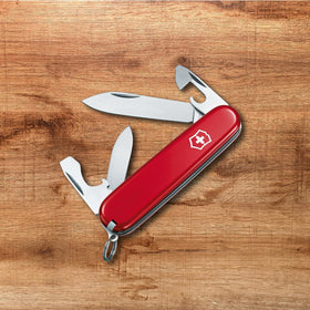 Victorinox Recruit knife closed with red handle for compact portability.