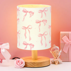 VIHOSE Bow Kids Table Lamp with linen shade provides warm bedside lighting