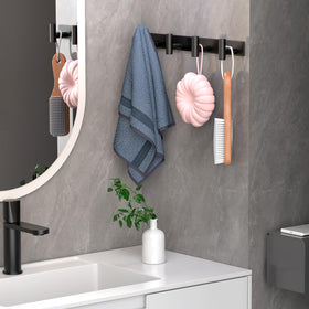 VINHOLD coat rack in a bedroom for jackets and bags, showing space efficiency.