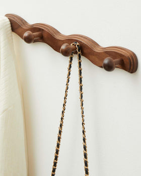 Vinoil walnut wall-hanger with smooth finish suits bedroom décor.