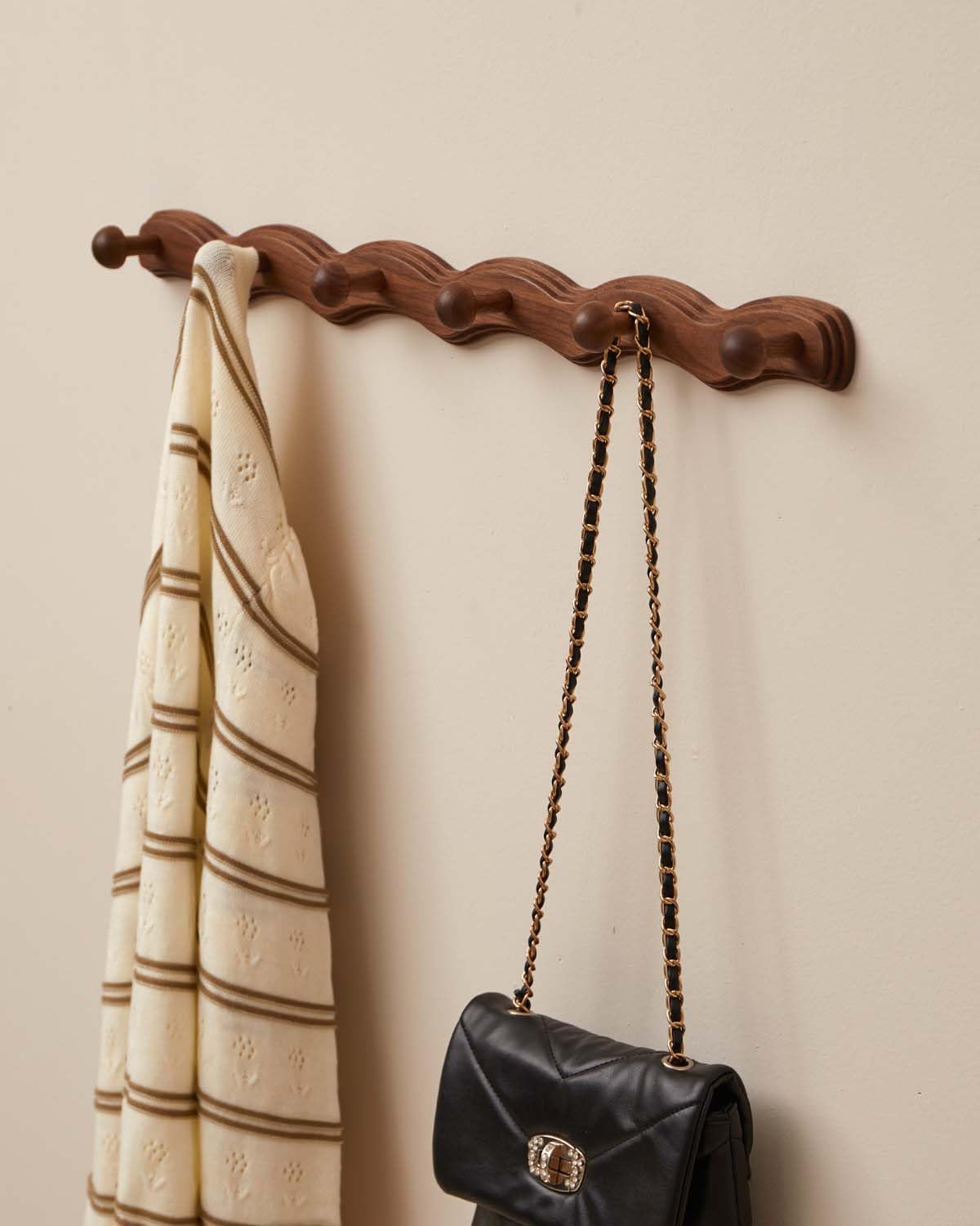 Vinoil walnut finish wall mounted coat rack ideal for jackets and bags.