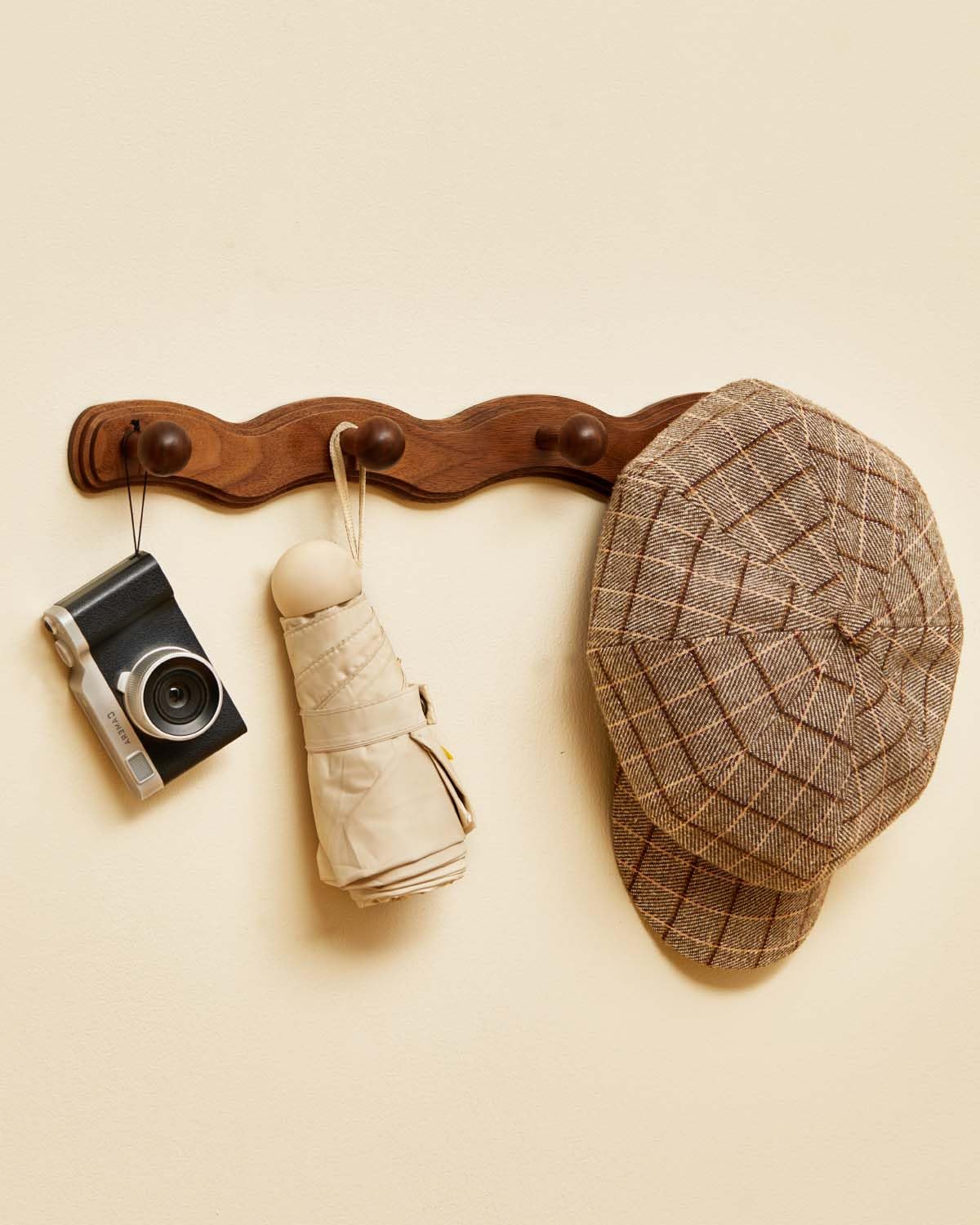 Vinoil wooden coat hooks for towels in bathroom or laundry area.
