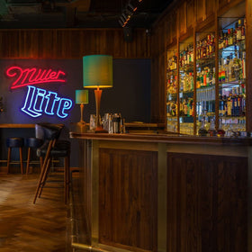 Vinray Miller neon sign enhances home bar décor and mood.