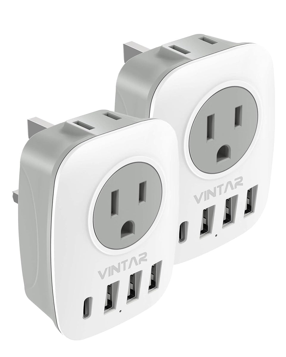 VINTAR travel adapter Type G with USB ports for multi-device charging.