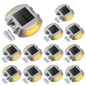VOLISUN 12-pack solar dock lights line up along a driveway for energy-efficient outdoor lighting.