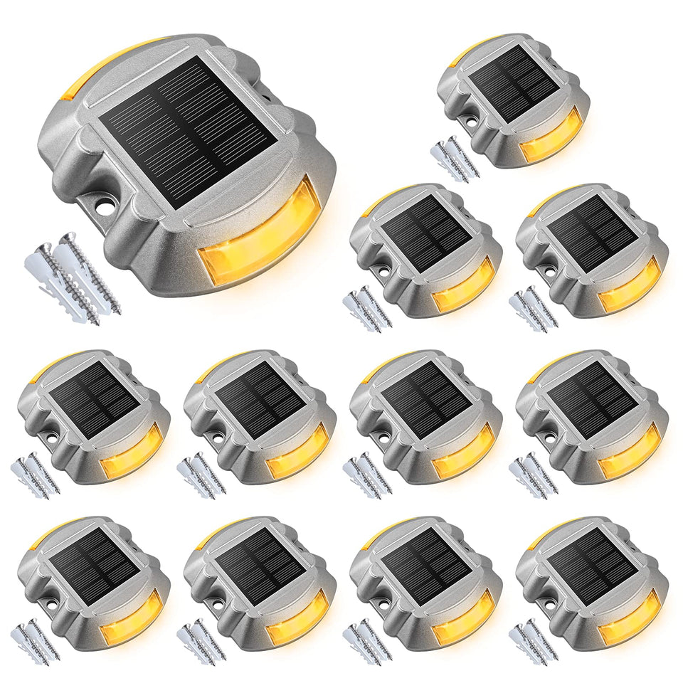 VOLISUN 12-pack solar dock lights line up along a driveway for energy-efficient outdoor lighting.