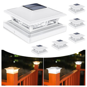 VOLISUN post cap lights illuminate a wooden 4x4 post at night with a warm glow.