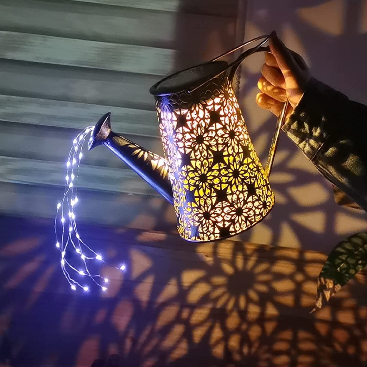 VOOKRY solar watering can lights create flickering night patterns for porches